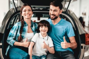 Family of 3 is sitting in the back of rental car, holiday on the Gold Coast - Gold Coast , QLD